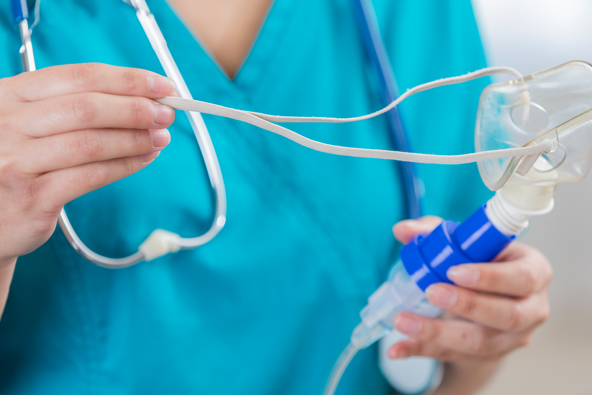 Doctor setting up medication to help a patient with pediatric asthma in Clearwater.