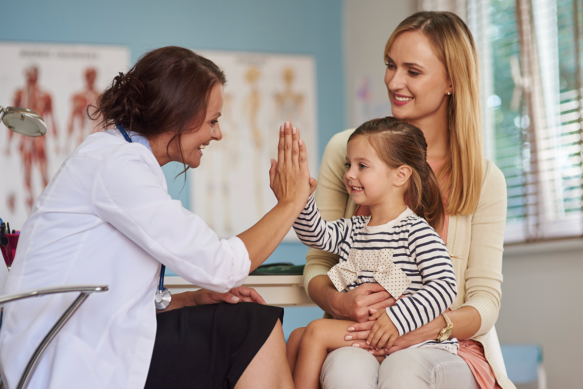 Small child being given doctor care for a pediatric fever in Clearwater.